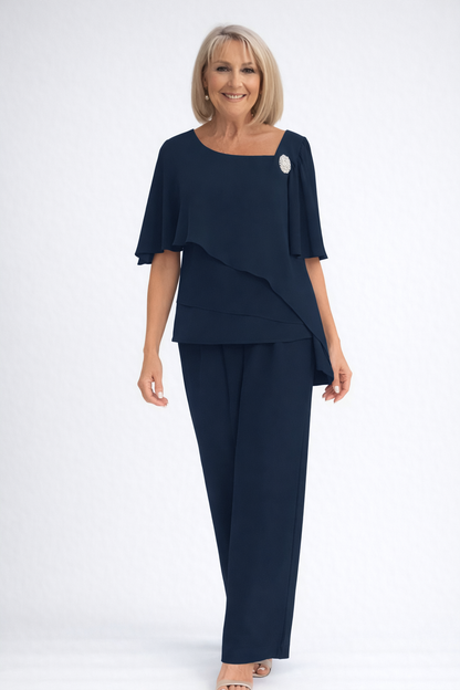 Women's formal two-piece layered top and wide-leg pants set in dark navy, with a square neckline and brooch.