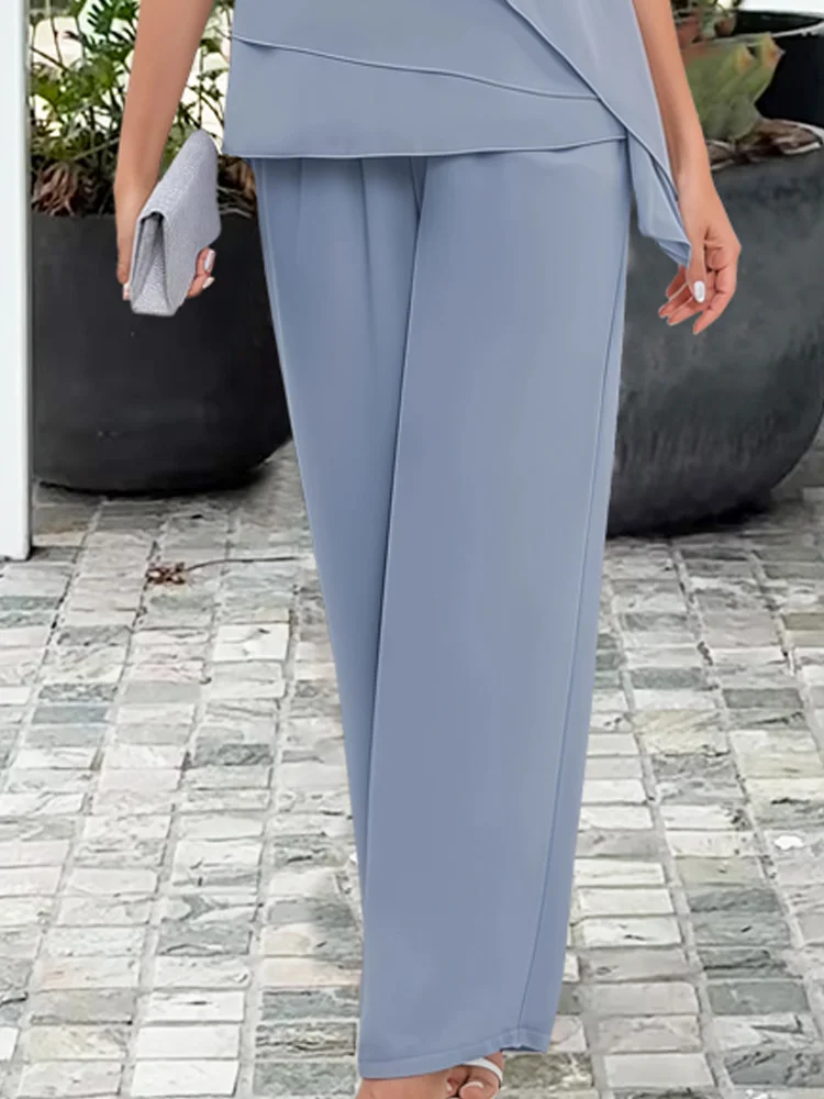 Close-up of the wide-leg pants from the light blue formal two-piece set, showing flowy fabric.