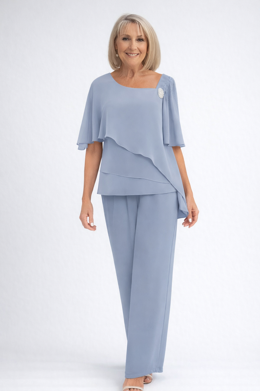 Women's formal two-piece layered top and wide-leg pants set in light blue, featuring a decorative brooch.