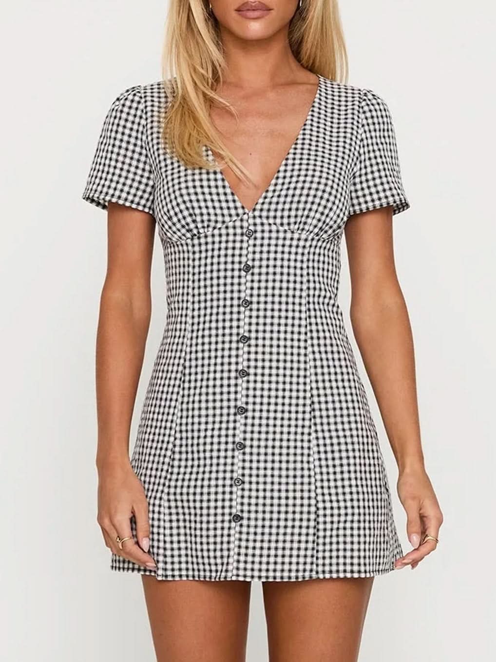 Black and white gingham mini playsuit front view with V-neck, short sleeves and button placket