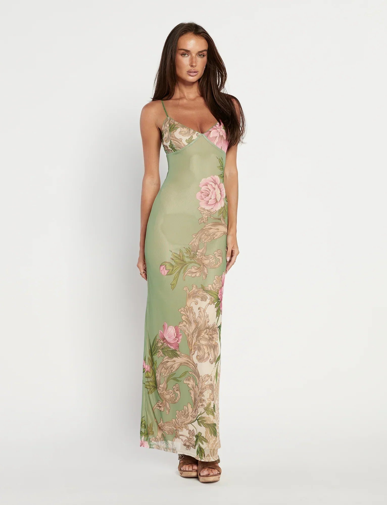 Full-length studio shot of sage green floral V-neck maxi dress, bodycon fit with large roses