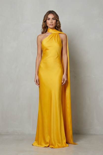 Elegant yellow formal halter draped open back maxi dress with a long train, ideal for women's wedding guest dresses or vacation outfits.