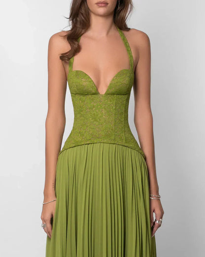 Close-up of the olive green formal halter neck maxi dress showing the lace corset detail and pleated skirt.