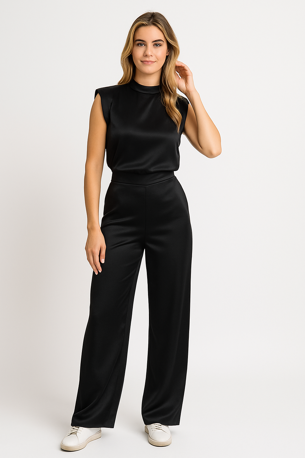 Full-length view of a black satin high neck wide leg jumpsuit for women, featuring padded shoulders and a sleek finish.