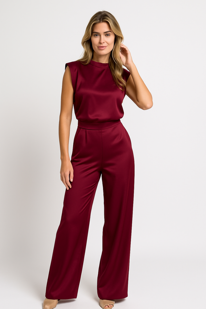 Rich burgundy high neck wide leg jumpsuit for women, crafted from a luxurious satin fabric with a flattering silhouette.