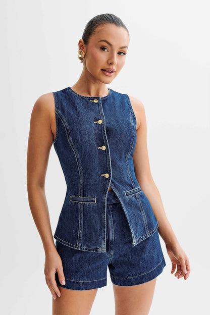 Close-up of dark wash denim vest top with gold buttons and seam detailing, two piece set
