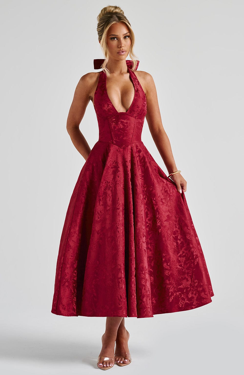 Rich red jacquard halter neck midi dress with a flattering deep V-neck and a voluminous A-line skirt.
