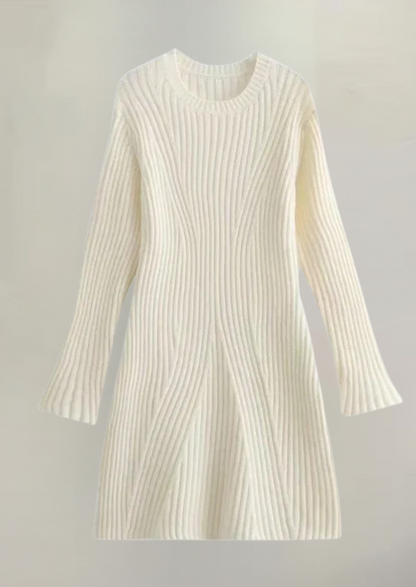 Flat lay of an ivory knit long sleeve ribbed mini dress, displaying the ribbed texture and flared cuffs on a light background.