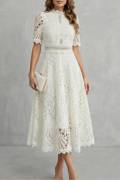 Elegant white lace high neck short sleeve midi dress with delicate cutouts, ideal for wedding guests.