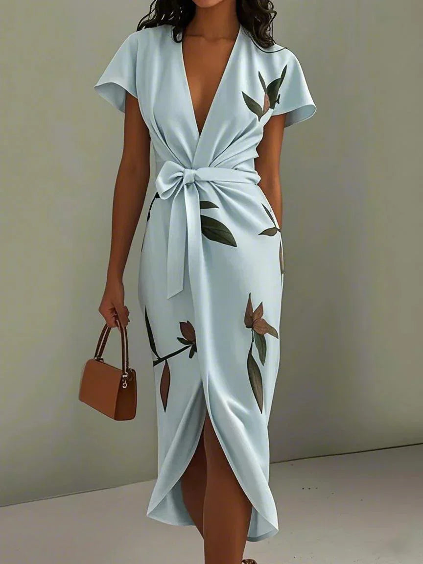 Light blue floral wrap maxi dress with flutter short sleeves, tie belt waist, and tulip hem slit