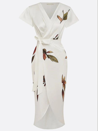 Midsection detail of ivory wrap tie waist maxi dress with long sash belt and front slit overlap