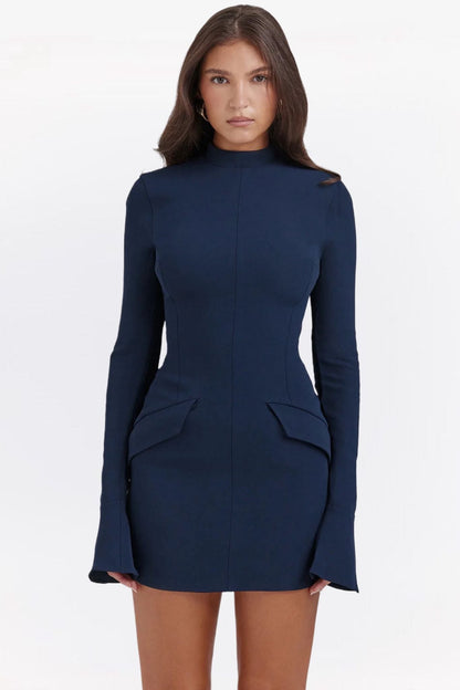 Front view of a navy long sleeve mini dress with a high neck and structured waist details.