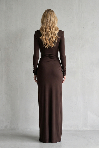 Back view of a brown long sleeve high neck maxi dress, showing the full length and fitted silhouette