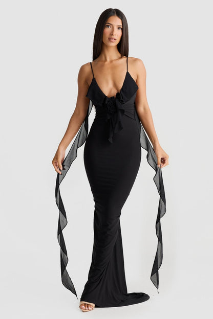 Front view of black bodycon maxi dress with plunging neckline, rose feature, and sheer straps, vacation dresses