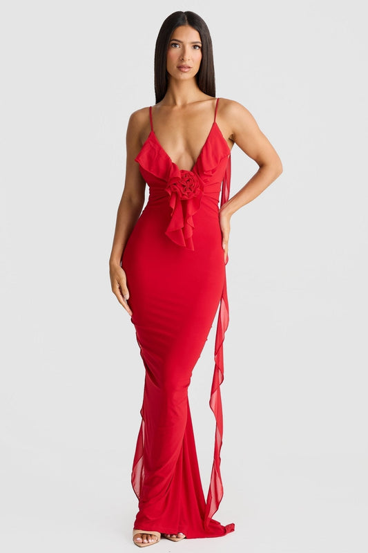 Front view of a red low back maxi dress with a deep V-neck, ruffled bodice, and delicate rose detail.