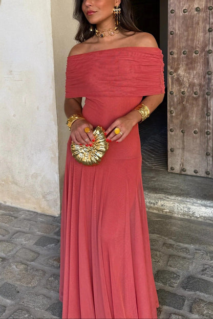 Front view of a women's off-shoulder draped mesh maxi dress in a vibrant coral pink, with a ruched bodice and flowing skirt.