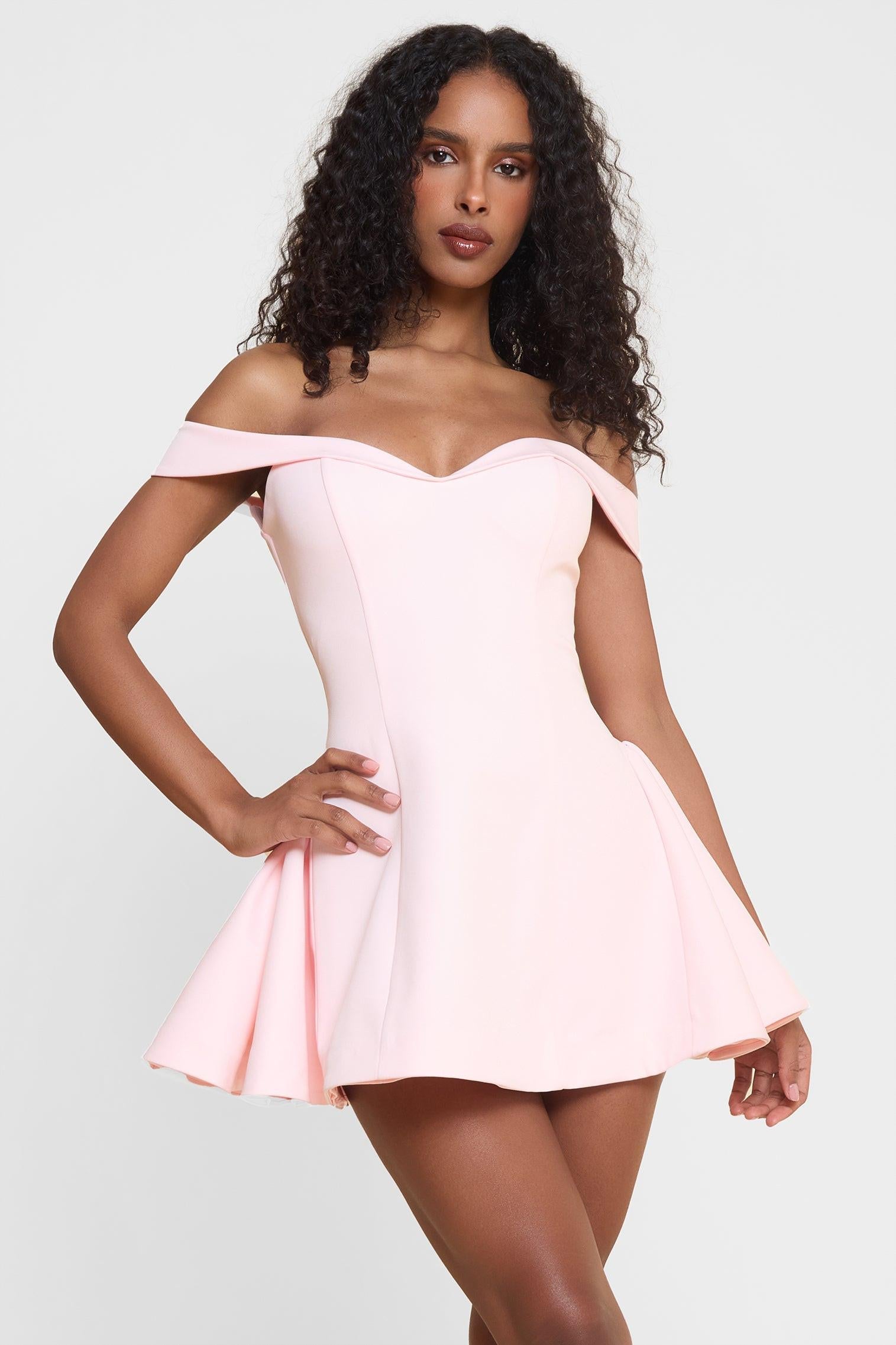Close-up of blush pink sweetheart corset bodice on off shoulder babydoll mini dress