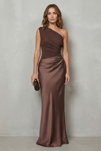Elegant brown one-shoulder satin maxi dress, showcasing the draped detailing on the bodice and a sleek silhouette, ideal for vacation outfits.