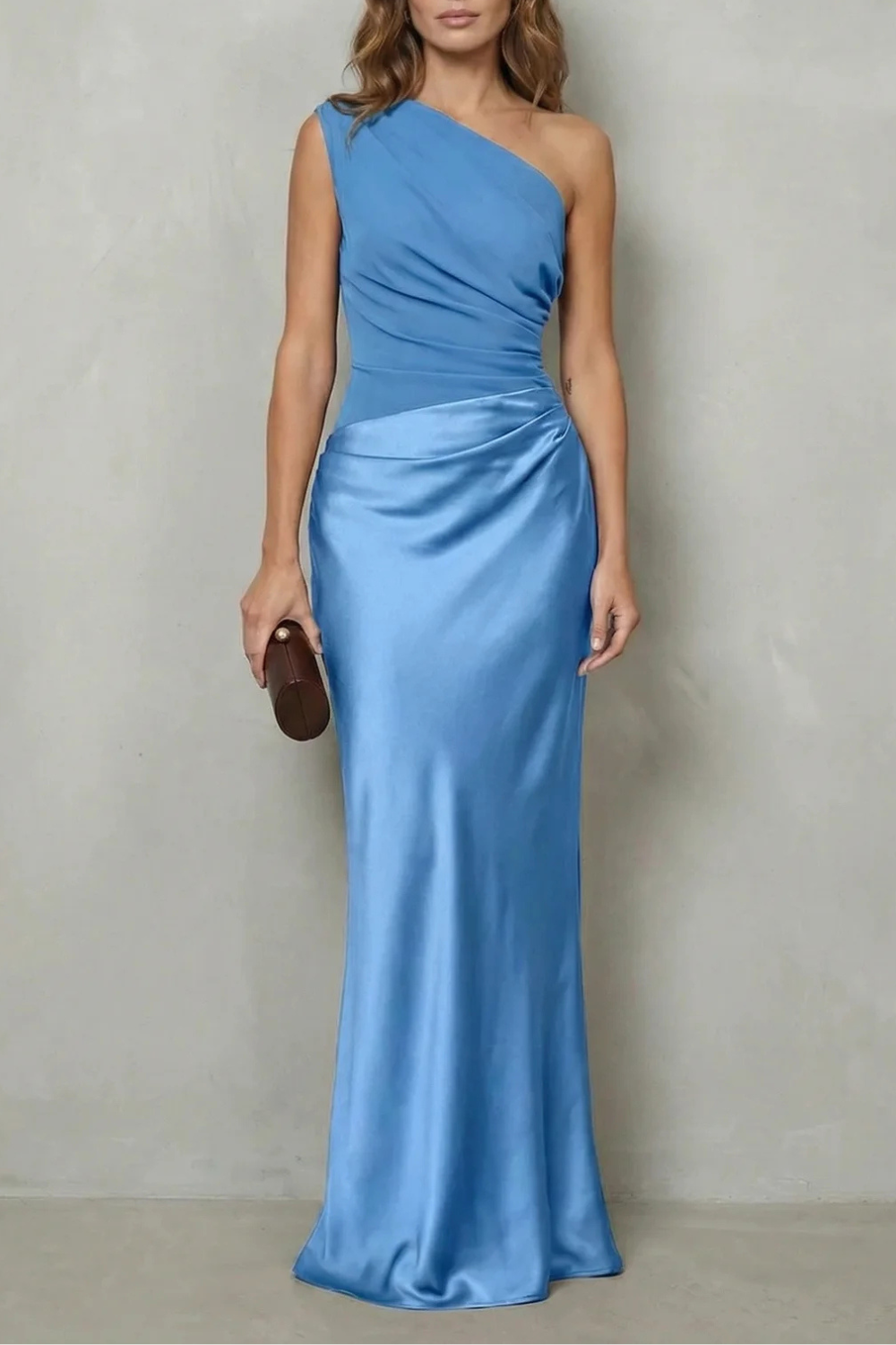 Front view of a women's light blue one-shoulder draped satin maxi dress, featuring a flattering silhouette and a subtle shimmer.
