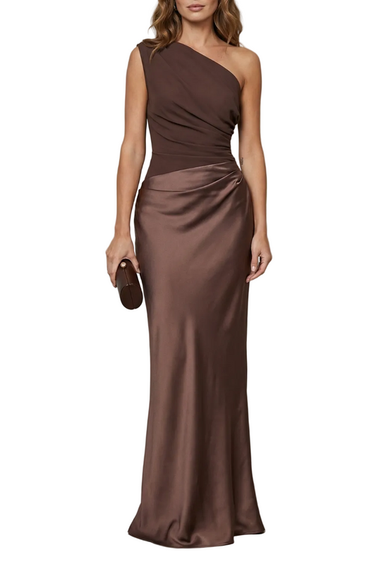 Front view of a brown one-shoulder draped satin maxi dress, featuring a fitted bodice and a flowing skirt, perfect for wedding guests.