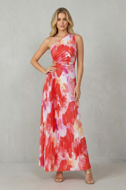 Women red and pink floral maxi dress with one-shoulder and side cut-out detailing on a grey wall background