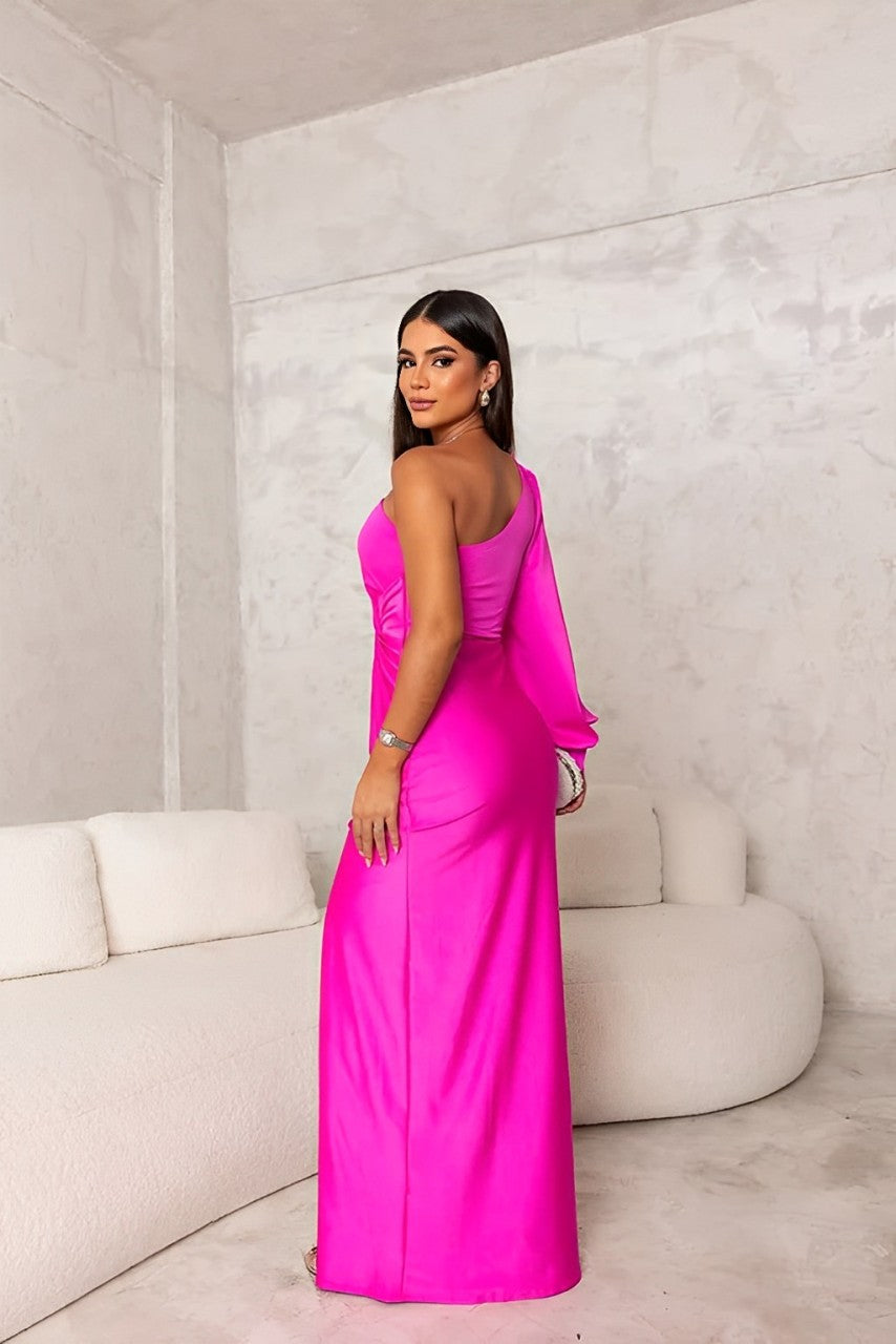 Back view of the fuchsia one-shoulder maxi dress, showing the elegant drape and full length, ideal for a formal event.