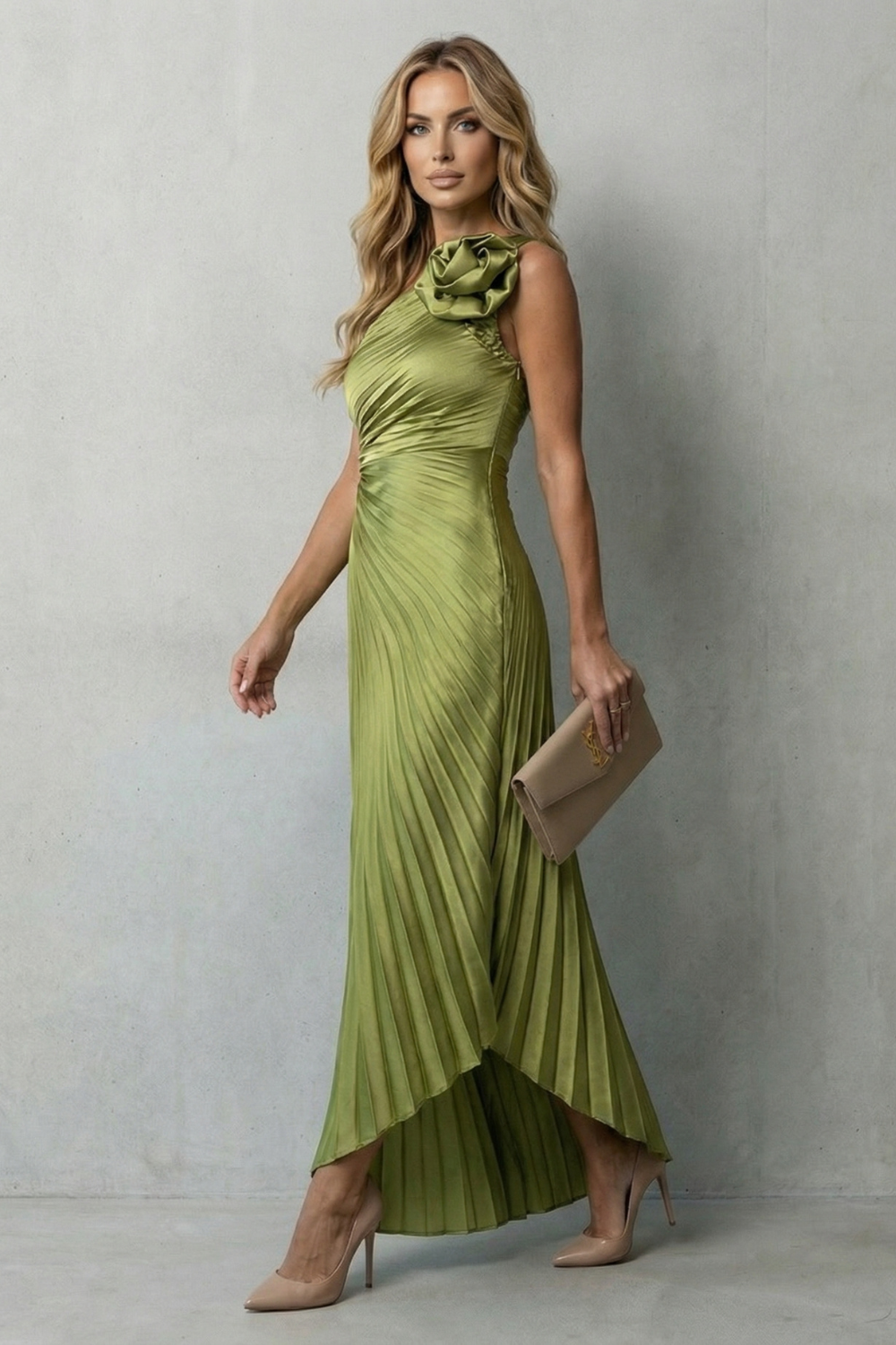 Side profile of a woman wearing a flowing olive green one-shoulder pleated maxi dress, perfect for wedding guests.