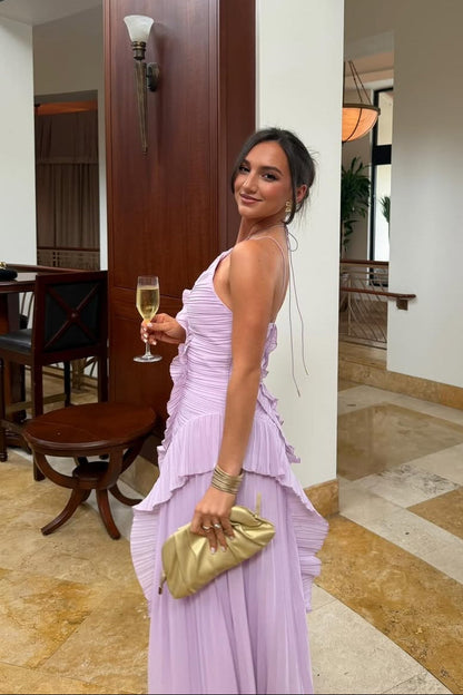 Side view of the women's pink one-shoulder ruffle pleated midi dress, showcasing the layered ruffles and pleated skirt.