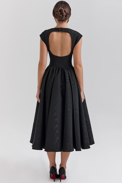 Back view of a black open back square neck midi dress with a keyhole detail and full skirt.