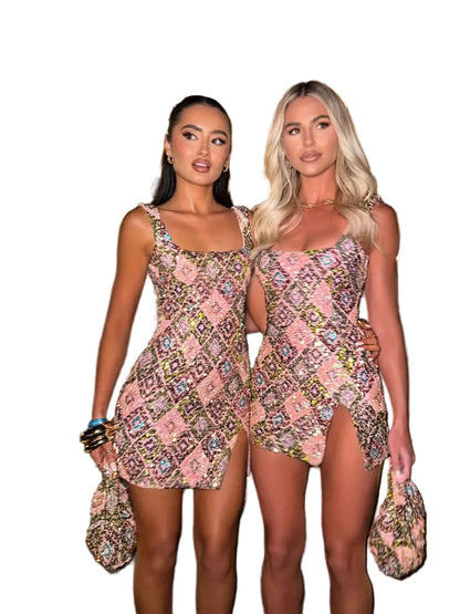 Two women wearing pink sequin square neck mini dresses with diamond patterns and side slits.