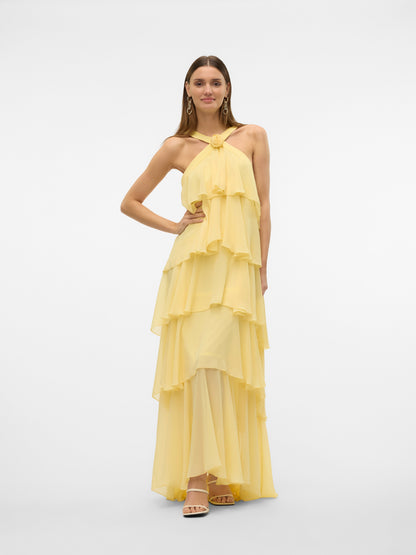 Back flat lay of a yellow halter ruffle backless maxi dress, showing the criss-cross back straps, open back, and full tiered ruffle skirt. Excellent for midi dresses for women.