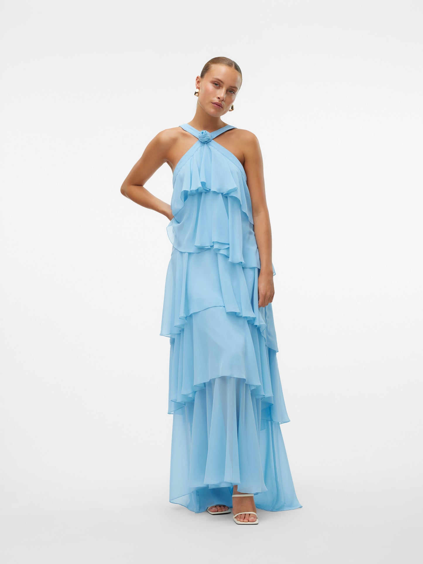 Full ghost mannequin view of the light blue ruffled halter neck open back maxi dress, highlighting its tiered skirt and flowy design.