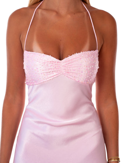 Close-up of the sequin embellished bust and halter neckline of the pink maxi dress.