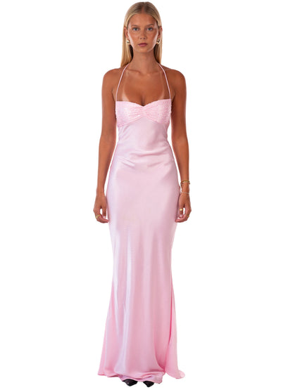 Full front view of a women's pink sequin halter neck backless maxi dress with a satin skirt.