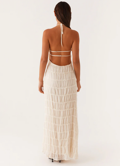 Ivory halter maxi dress back view with open back straps and sheer tiered skirt to ankle length