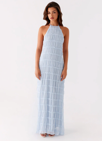 Light blue pleated halter maxi dress with ruffled lace stripes, full-length front view