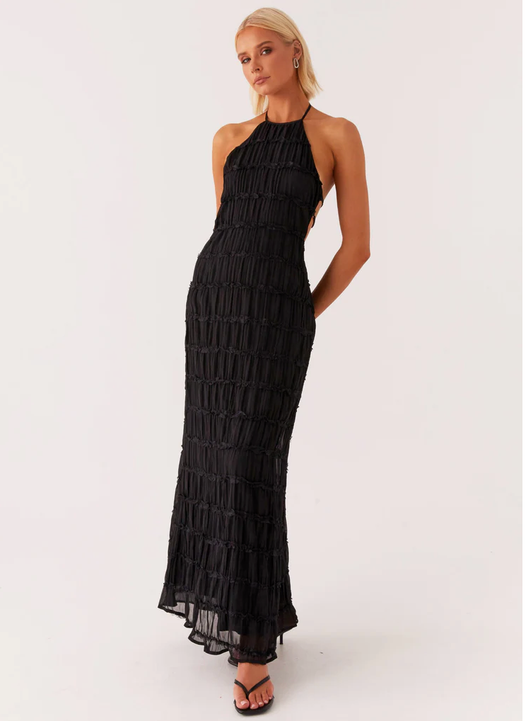 Black pleated halter maxi dress with lace trim tiers and sheer ruffle hem, front view