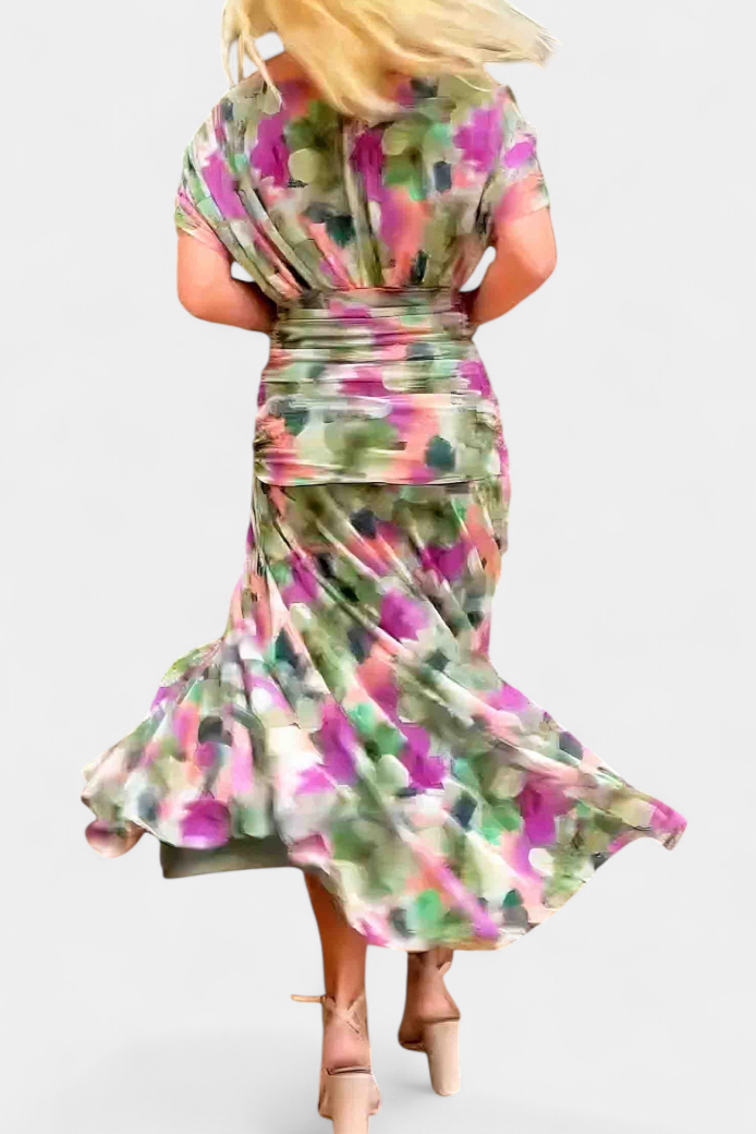 Back view printed off shoulder ruched maxi dress with ruched waist band and flowing floral maxi hem