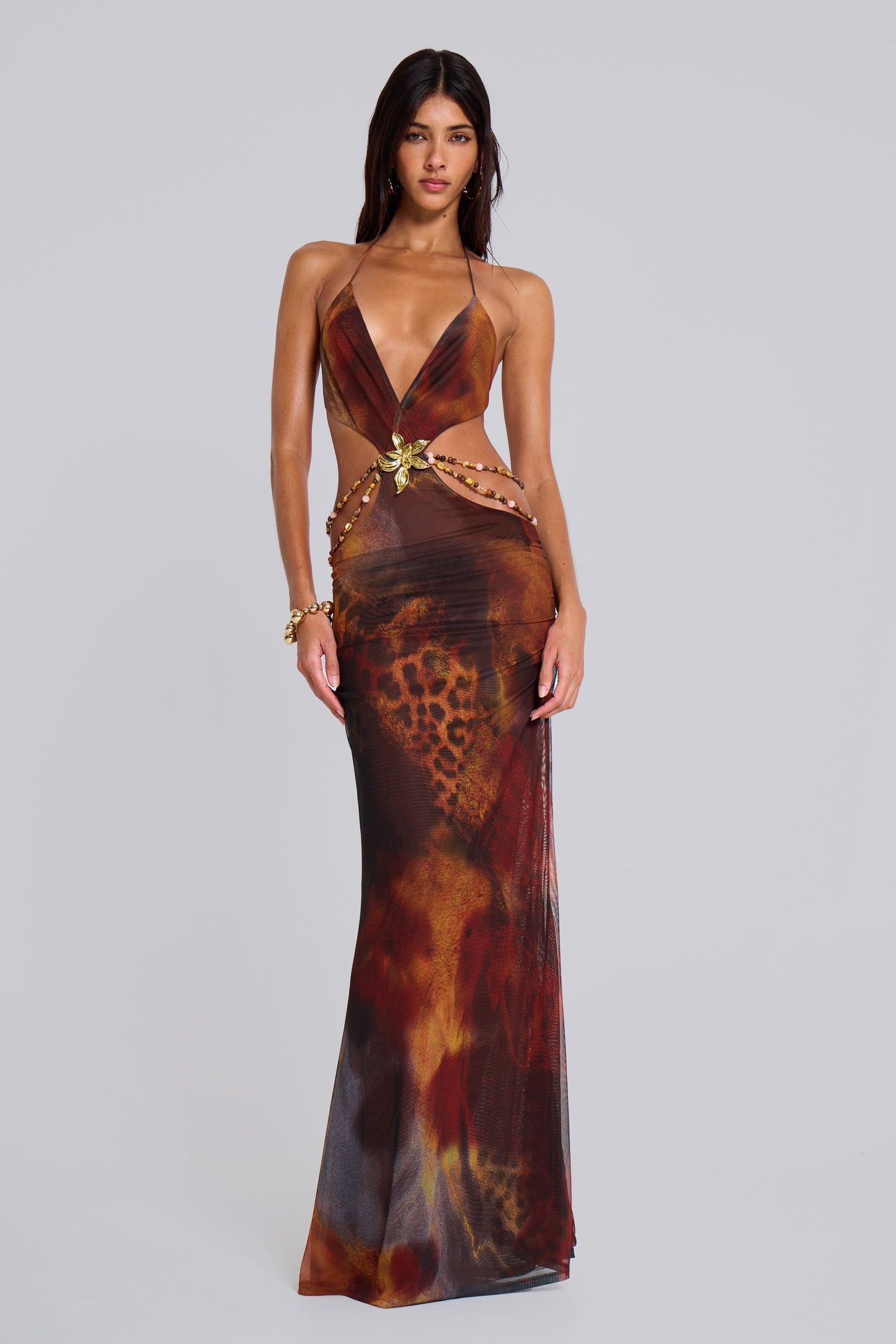 Front view of the women's printed plunge halter cut-out maxi dress, highlighting the flattering silhouette and vibrant print, suitable for elegant dresses for wedding guests.