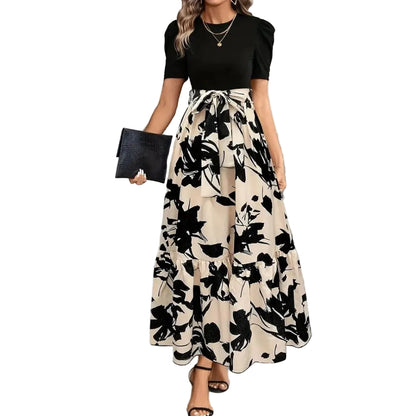 Women's elegant black and beige floral printed maxi dress with puff sleeves and tie waist, perfect for vacation outfits.