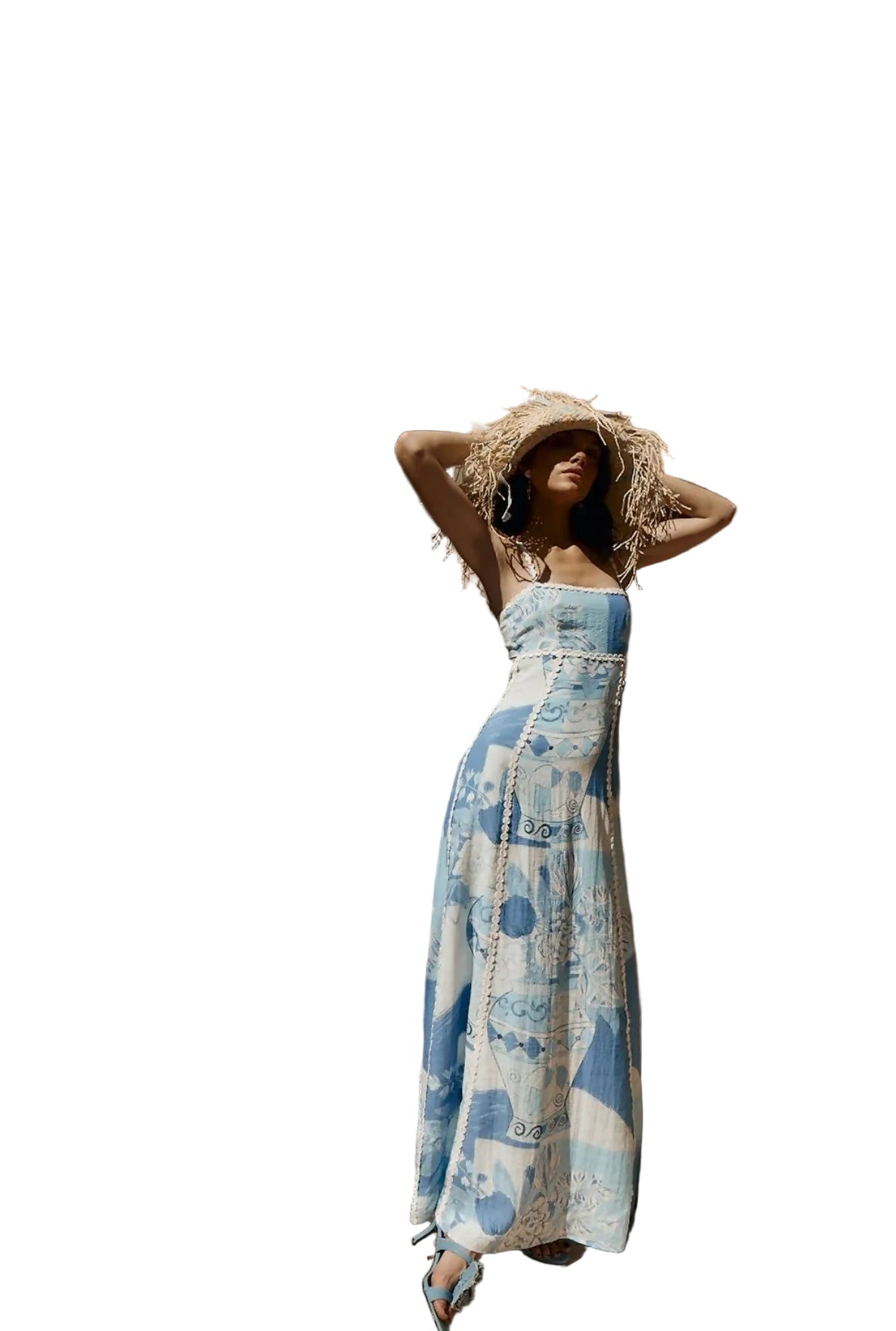Women's blue and white printed maxi dress with ric rac trim and tie back, styled with a straw hat, perfect for vacation outfits.