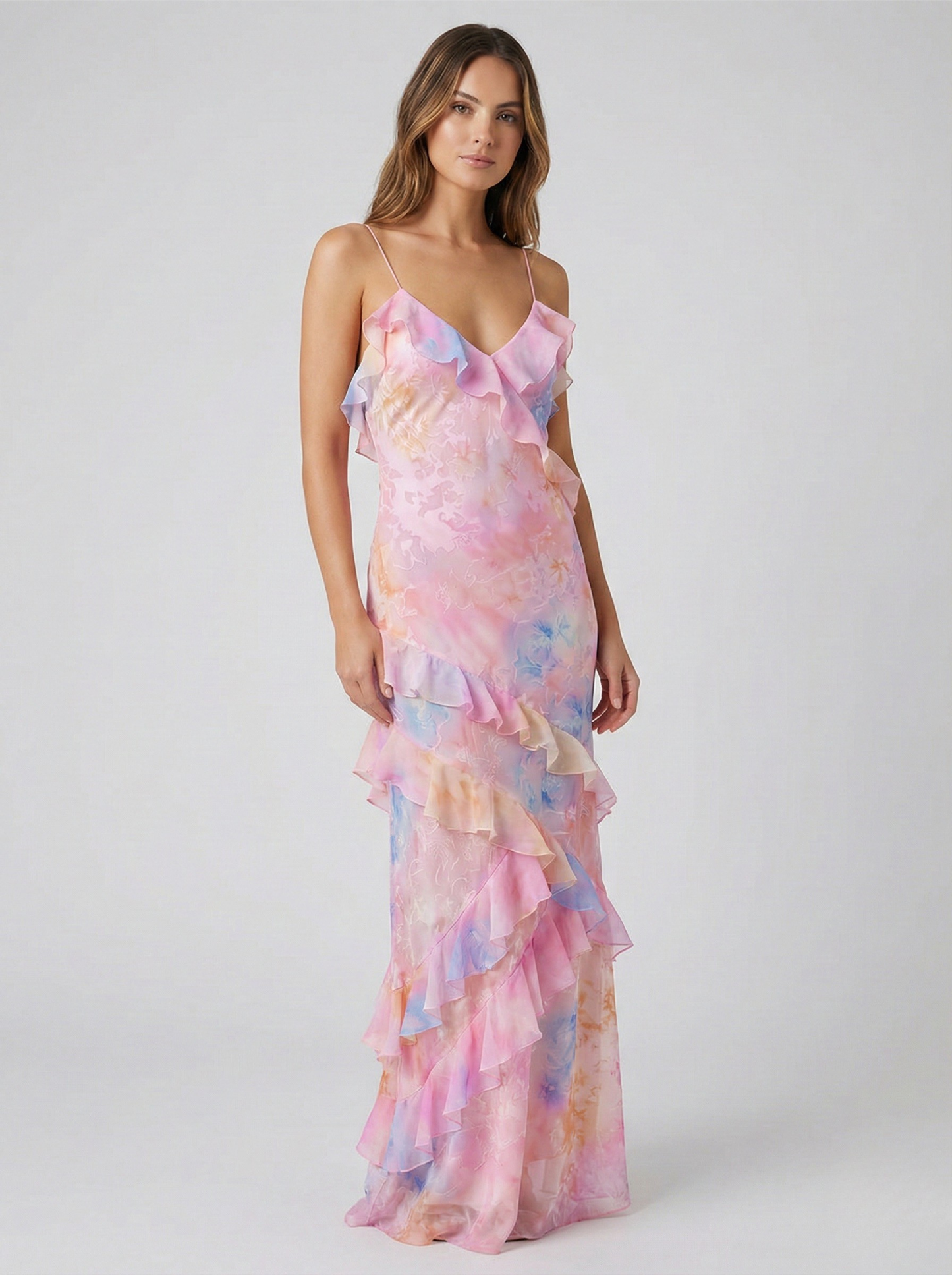 Women's pink and blue pastel floral maxi dress with tiered ruffles and spaghetti straps.