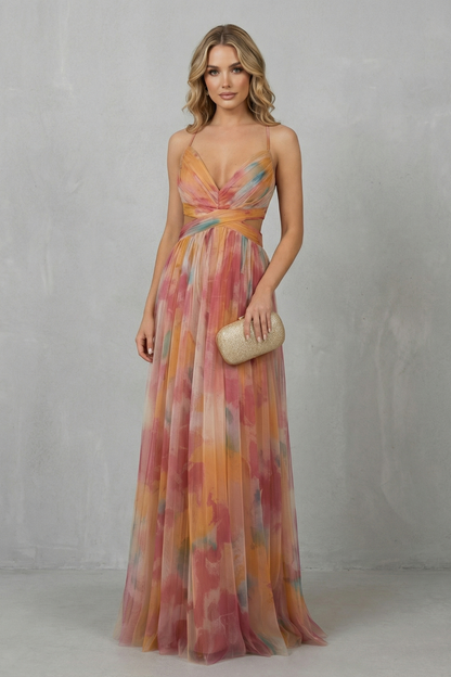 Elegant women's printed V-neck formal maxi dress in a flowing orange, pink, and yellow pattern, with subtle waist cut-outs and spaghetti straps.