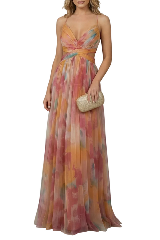 Women's formal maxi dress with a V-neck and cut-outs, featuring a vibrant orange, pink, and yellow watercolor print, holding a gold clutch.