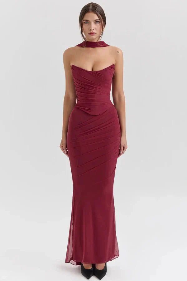 Model wearing the Hailey burgundy ruched mesh maxi dress with matching detachable choker by Kouvr, front view.
