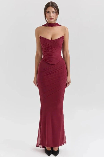 Model wearing the Hailey burgundy ruched mesh maxi dress with matching detachable choker by Kouvr, front view.