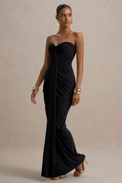 Side view black slinky jersey maxi dress with ruched bodycon fit and floor-length hem