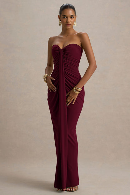Full-length burgundy off shoulder ruched slinky jersey maxi dress with center drape and fitted bodycon skirt