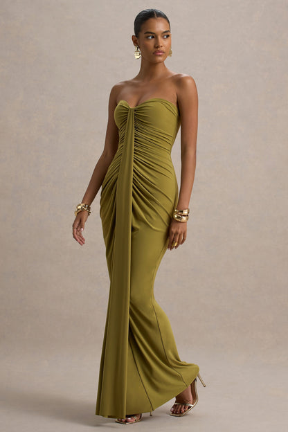 Three-quarter view olive green off shoulder maxi dress with ruched torso and flowing floor length slinky skirt