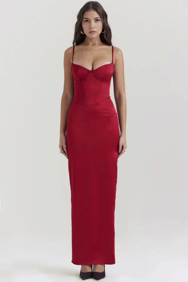 Model wearing the red Haven satin corset maxi gown by Kouvr Fashion, showcasing the vibrant color and elegant silhouette.